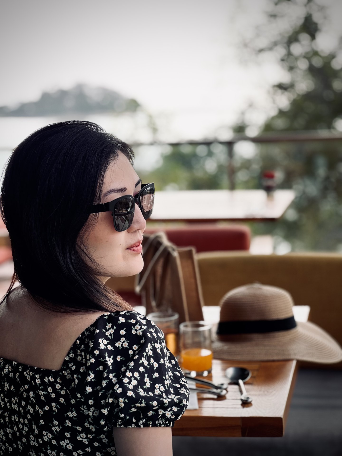 Creator at a breakfast table overlooking the sea and a nearby island